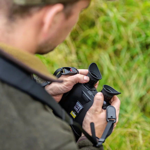 man holding a scope
