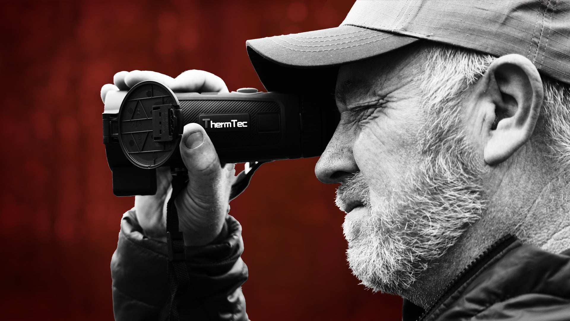 man holding a thermtec night vision desktop